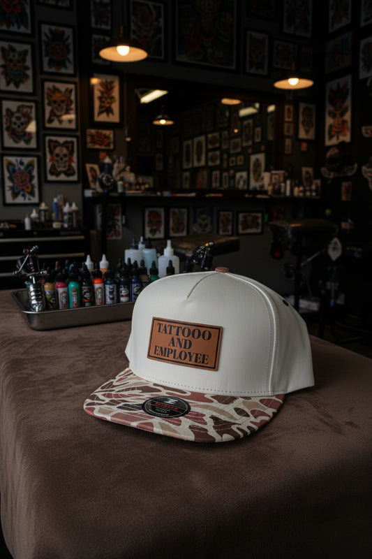 Tattooed and Employed Brown duck camo bill snap back hat.