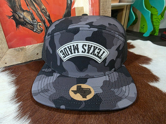 Upside down TEXAS MADE black camo 7 panel snap back hat.