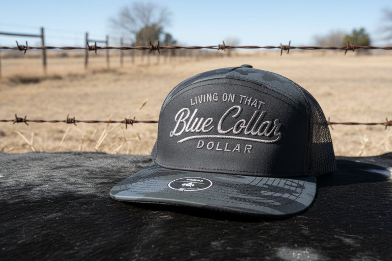 Blue collar embroidered snapback hat. 2 tone black camo