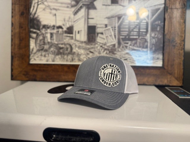 One nation under God flag patch in white snap back cap.