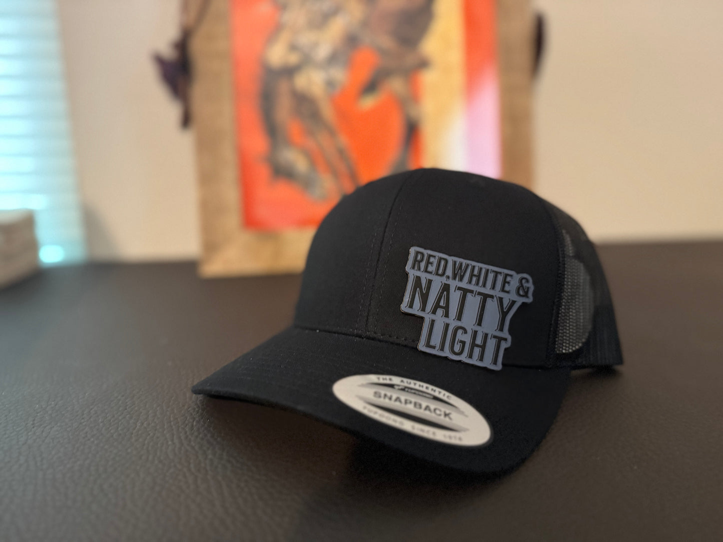 Red,white&Natty light patch in blue with hat.