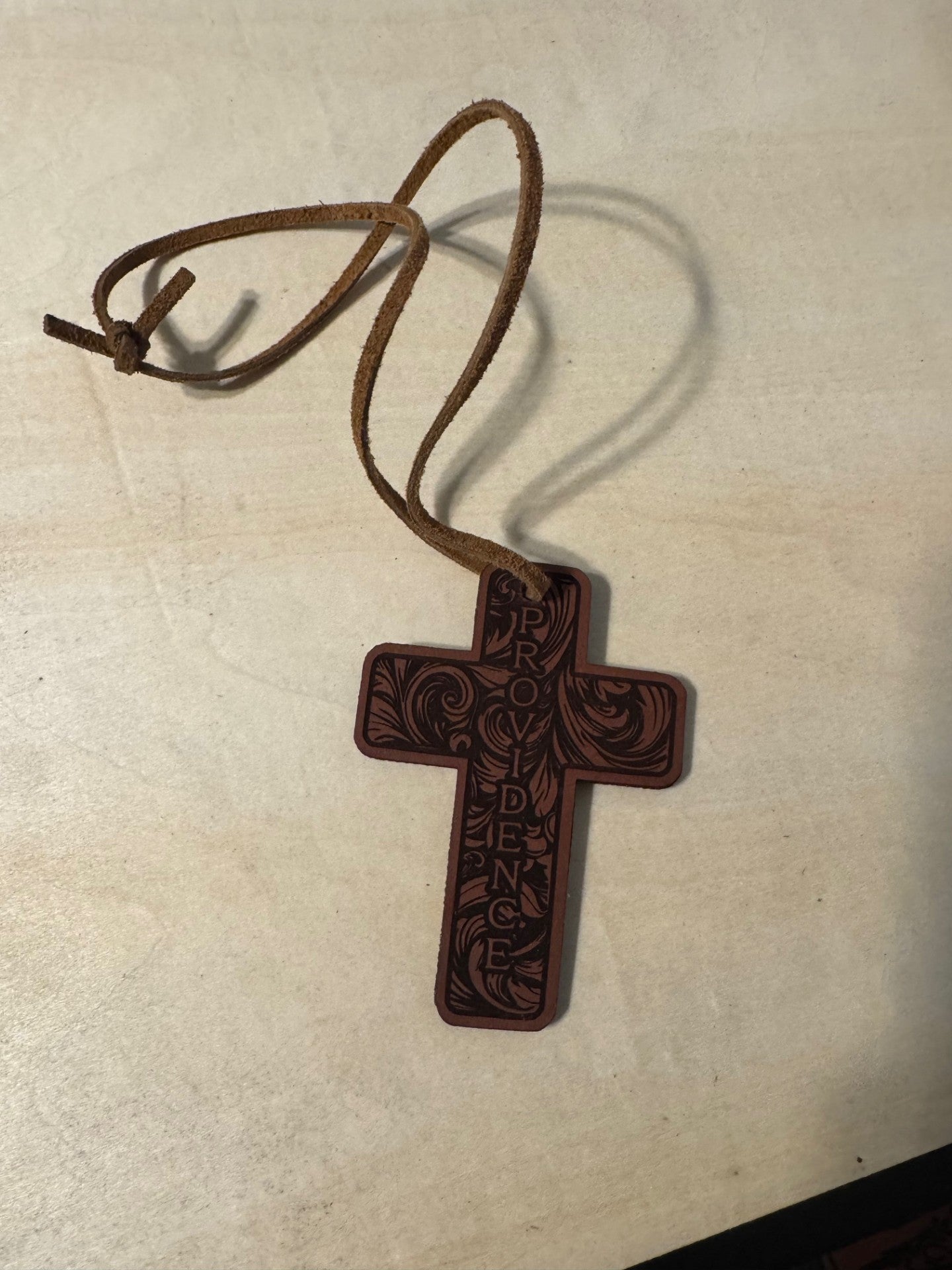Leather cross rearview mirror charm. tooled Providence design.