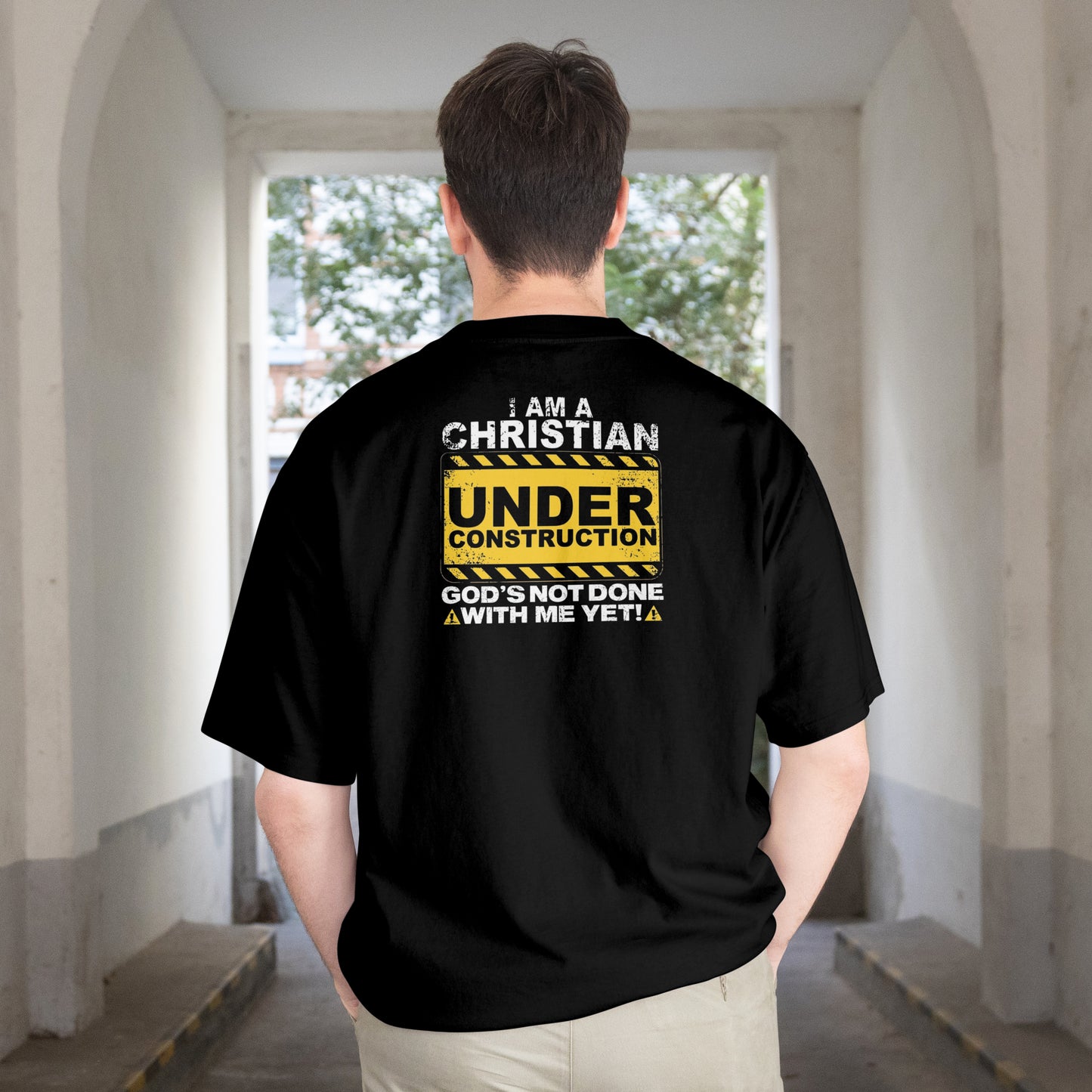 A CHRISTIAN UNDER CONSTRUCTION TEE.