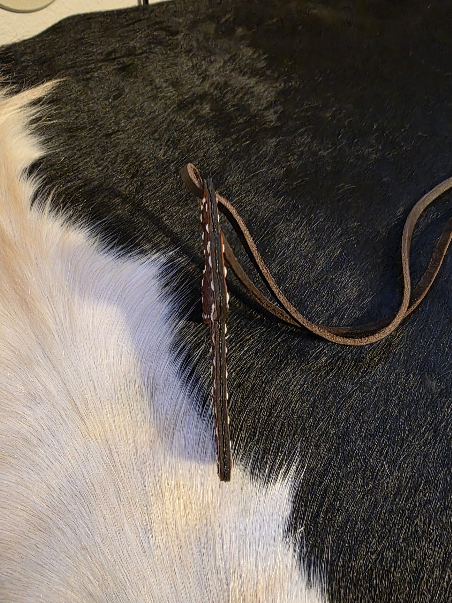 Hand stitched leather rearview mirror cross. Providence design.