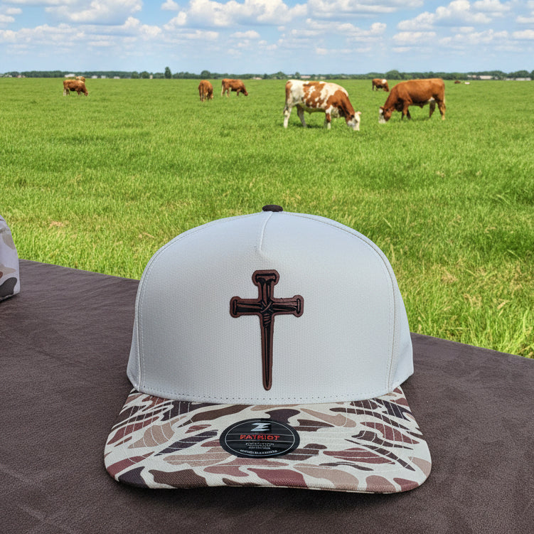 Nail cross patched Camo bill snap back hat. Water repellent!