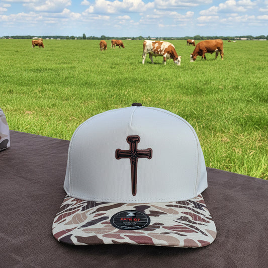 Nail cross patched Camo bill snap back hat. Water repellent!