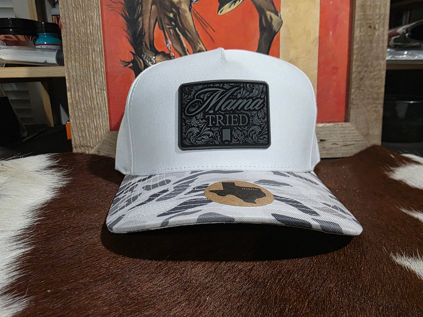 Mama Tried canvas top snap back cap with snow camo bill.