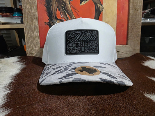 Mama Tried canvas top snap back cap with snow camo bill.
