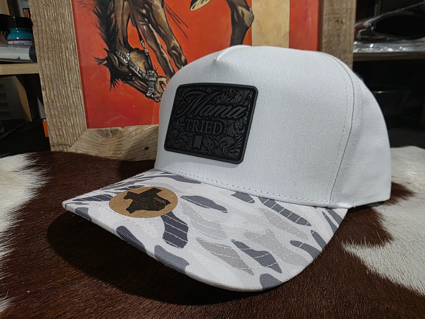 Mama Tried canvas top snap back cap with snow camo bill.