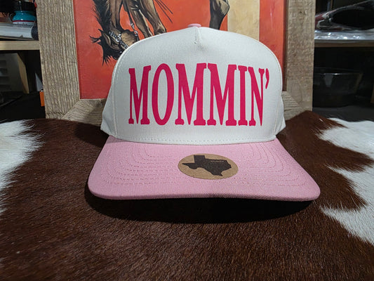 MOMMI'N Canvas top snap back cap with pink bill.