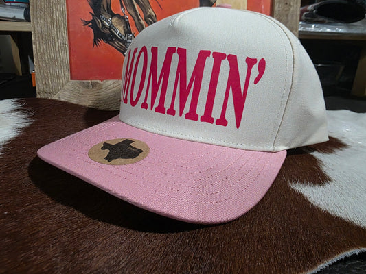 MOMMI'N Canvas top snap back cap with pink bill.