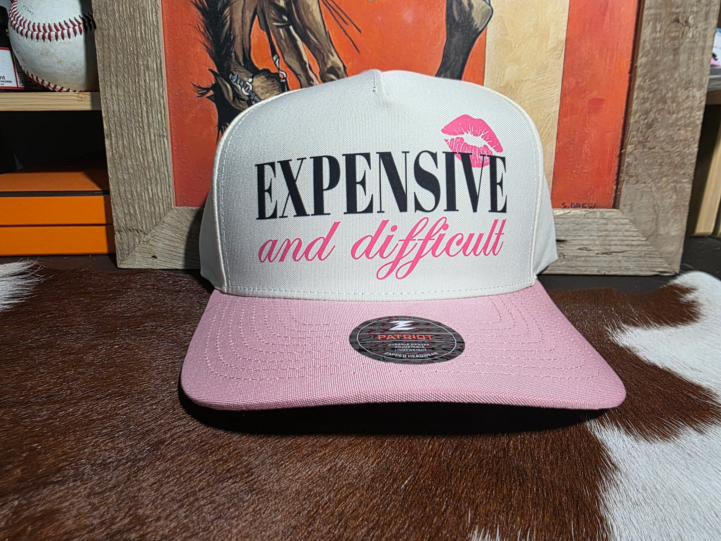 Expensive & Difficult snap back hat in pink and beige.