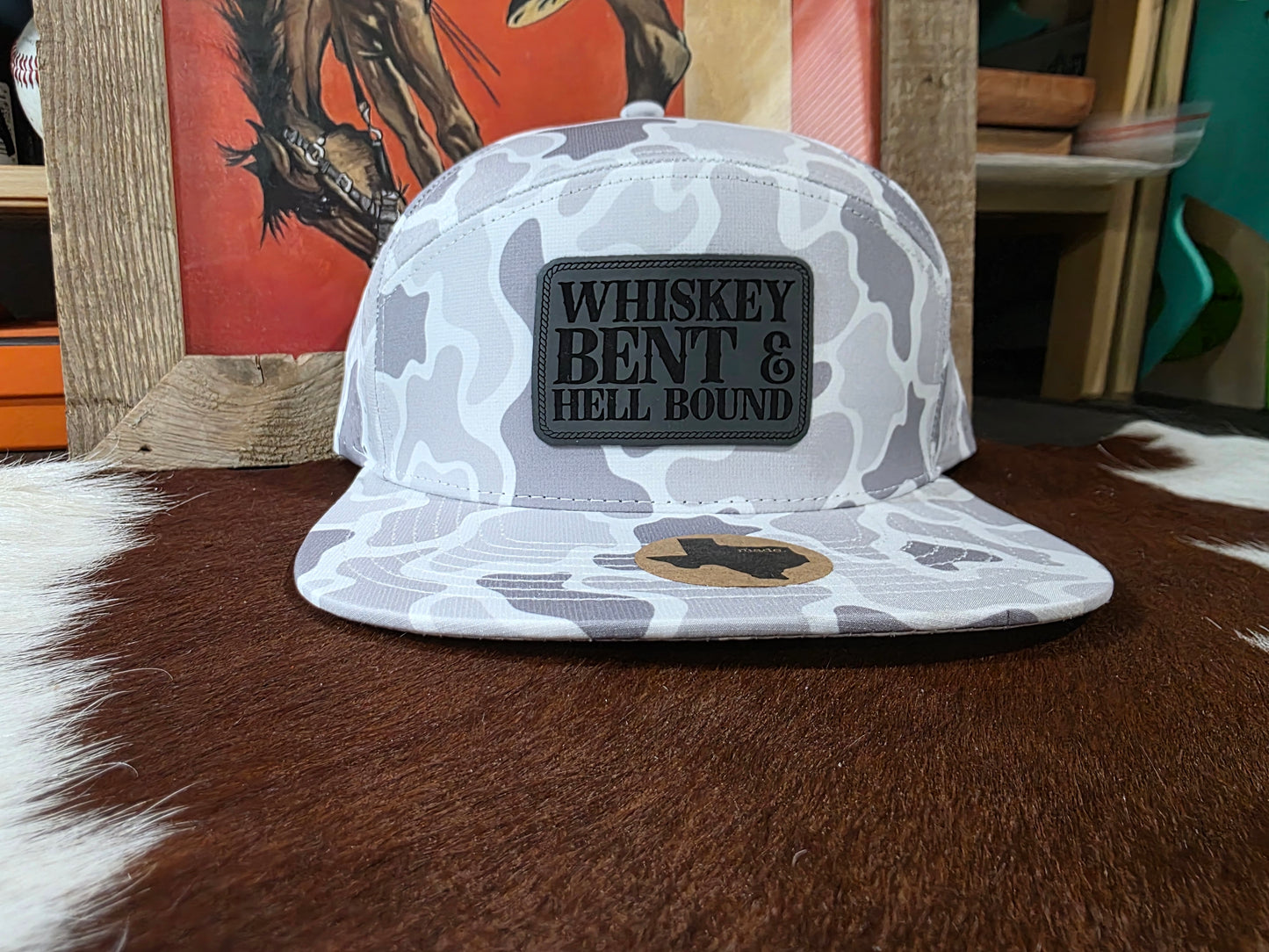 Whiskey bent patched 7 panel snap back hat in snow camo.