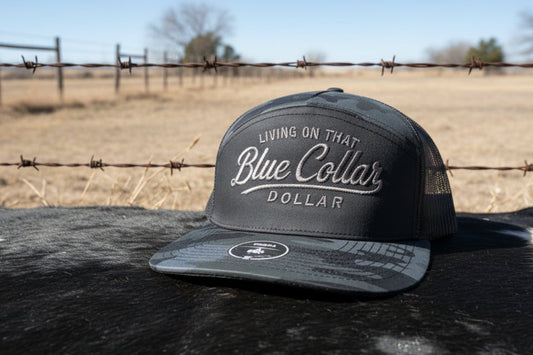 Blue collar embroidered snapback hat. 2 tone black camo