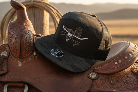 Cowboy embroidered design on a 7 panel flat bill cap.
