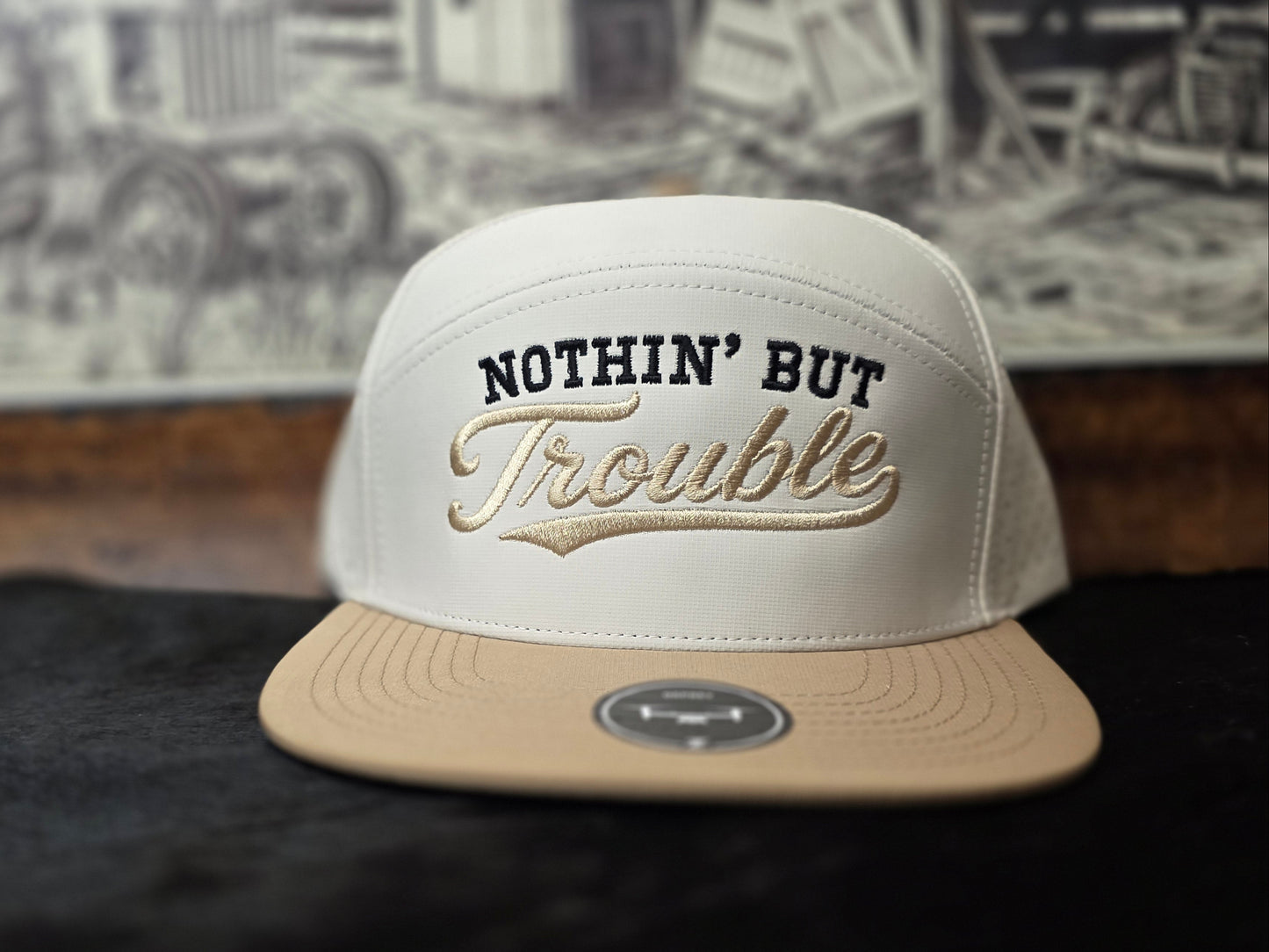 NOTHIN' BUT TROUBLE. Beige and white 7 panel snapback.