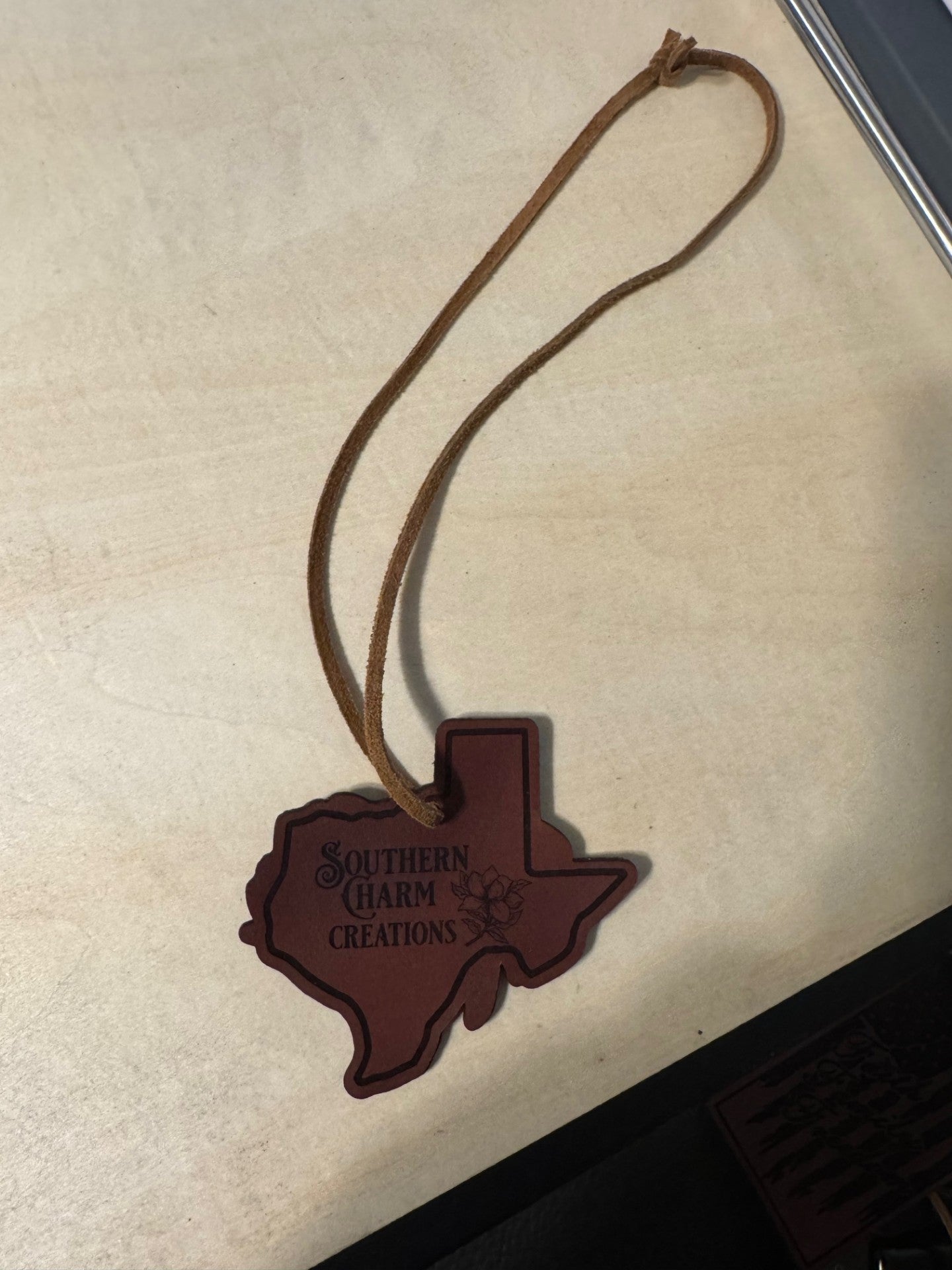 Texas made leather rearview mirror charm.